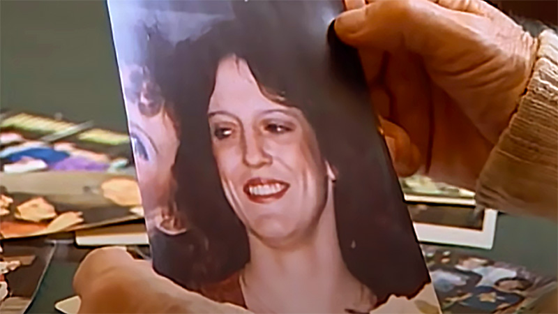 Father Melvin Duguay looks at photo of daughter Shirley