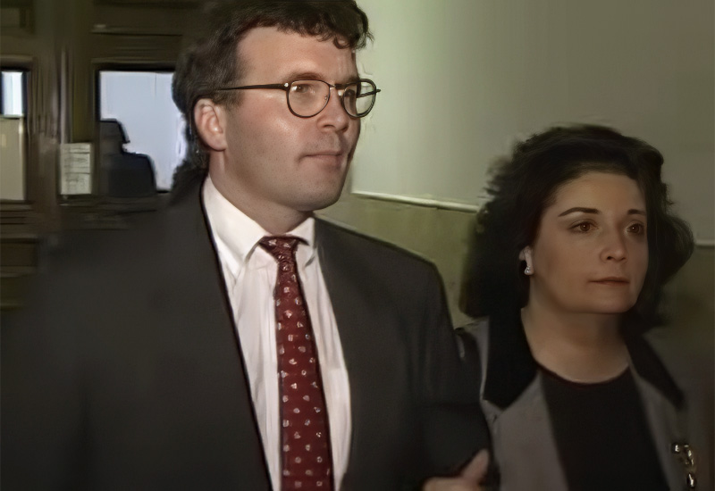 Deboarah and Anthony walk together in a courthouse