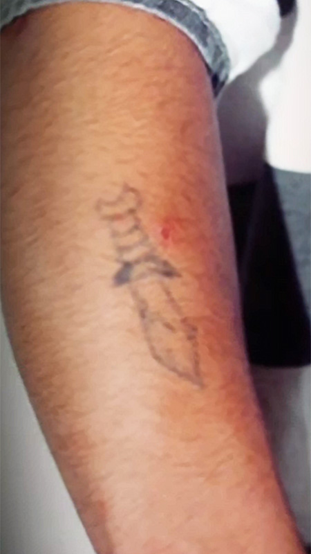 Jose Castillon forearm dagger tattoo