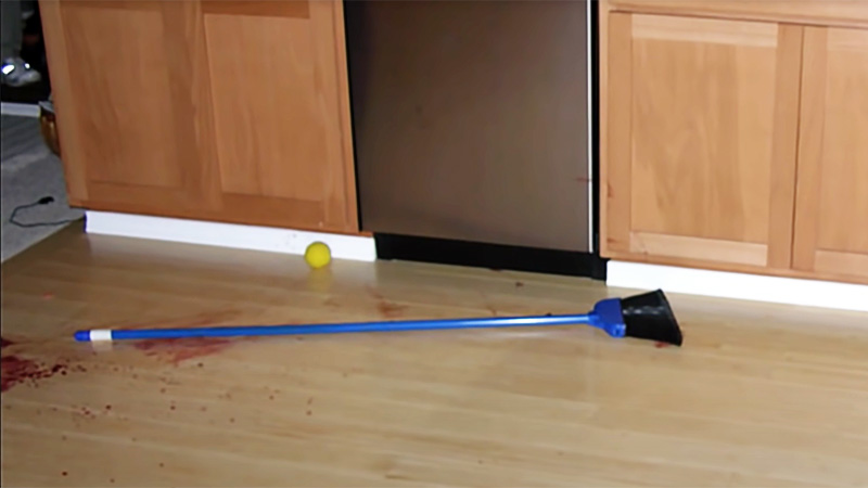 Broom with blood in the Maucks kitchen