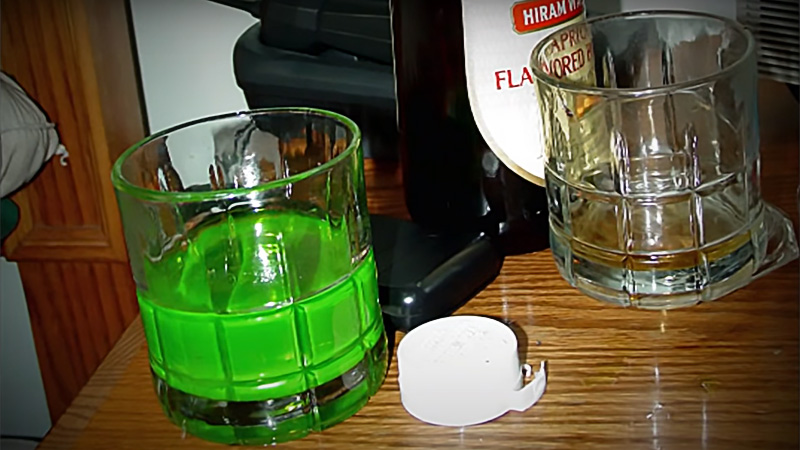 Glasses on nightstand, one contains antifreeze